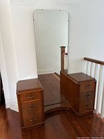 Full view of Art Deco vanity showing mirror, twin pedestals, curved base