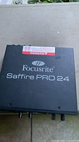 Top view showing Focusrite Saffire PRO 24 branding and warning label