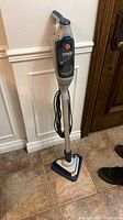 Full view of Hoover SteamScrub steam mop standing upright