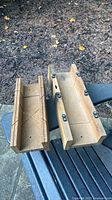 Two wooden miter boxes on bench, showing overall form and kerf slots