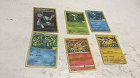 All six holographic Pokémon cards laid out together