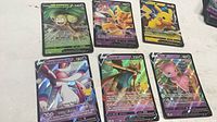 All six Pokémon V cards arrayed on surface