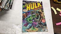 Front cover of The Incredible Hulk #197 showing Hulk battling Man-Thing