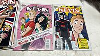Stack of Kevin Keller comics showing two issues including Kevin vs Veronica and superhero cover