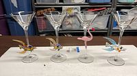 Four martini glasses showing all stem ornaments