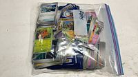 Full Ziploc bag filled with Pokémon cards