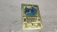 Front of metal Shining Charizard card showing artwork, stats and text