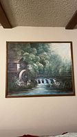 Full frontal view of framed oil painting on wall