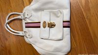 Front view of white tote with center stripe and front pocket