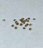 Grouped loose champagne diamonds on white background