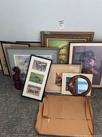 Group shot of all framed art, wood salmon, mirror