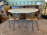 Table with two matching chairs, front view