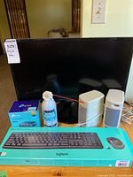 All items grouped: Samsung monitor, Logitech MK270 box, TP-Link switch box, Ultra Duster can, Enjoy speakers