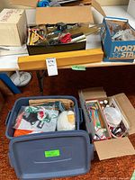 Overview showing tote, boxes, and assorted craft contents