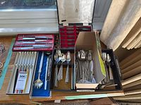 Overview of all utensils including steak knives case, fondue forks, salad servers, flatware