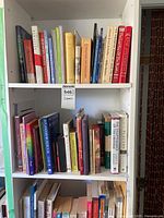 Upper shelves showing varied hardcovers and paperbacks