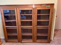 front view showing three glass doors and overall style