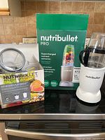 Motor base with cup, Deluxe Upgrade Kit box, and Pro retail box