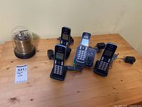Overview of four Panasonic handsets with bases and adapters, plus Barigo weather station