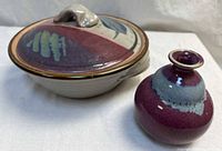 Covered bowl and vase side by side showing overall form and glaze