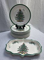 Stack of plates with one displayed, plus divided dish