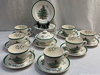 Full set arranged showing cups, saucers, plates, sugar bowl