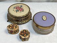 all four boxes grouped to show relative sizes, shapes and decoration