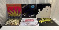 Six album covers: Jefferson Starship Gold, Jefferson Starship Earth, unidentified minimalist face LP, Rough Trade genre compilation, The Communards Tomorrow, Berkeley Christmas