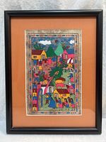 Full view of framed painting showing frame and mat