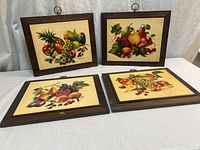 All four framed prints displayed together