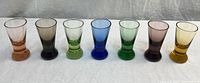 Full lineup of seven multi-colored pedestal glasses