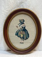 Front view of framed needlepoint artwork