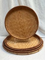 Front view of largest tray upright and others stacked