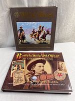 Both hardcover Western history books front covers visible