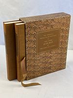 Boxed set standing showing spine and ribbon