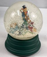 Front view of Dept. 56 chimney sweep snow globe