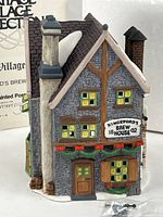 Front view of porcelain Kingsford’s Brew House with sign area visible, box in background