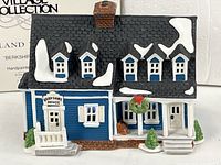 Front view of Berkshire House figurine with box background