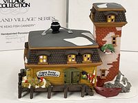 Front view of Cape Keag Fish Cannery building with dock and smokestack