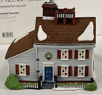 Front view of Jeremiah Brewster House showing door, wreath, shutters, roof snow