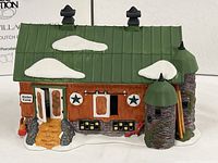 Front view of porcelain barn showing doors, windows, silos, roof details and snow accents