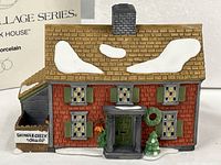 Front view of porcelain Shingle Creek House with original box background