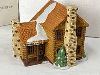 Front view of porcelain Timber Knoll Log Cabin building