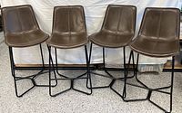 All four matching bar stools front view