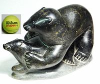 Front-left view showing overall form and inserted tennis ball for scale