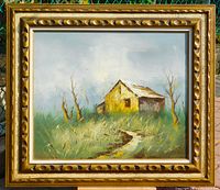 Full view of framed painting showing landscape subject and frame style