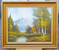 Framed landscape painting on easel showing full view with frame