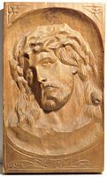 Front view showing entire carved relief of Jesus Christ on wooden plaque