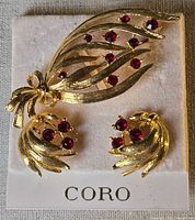 Front view of brooch and earrings on Coro card
