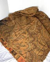 Folded Victorian paisley textile showing overall color and pattern